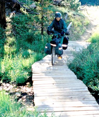 Terry crosses a foot bridge.