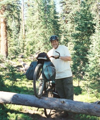 Dennis crosses some trail debris.