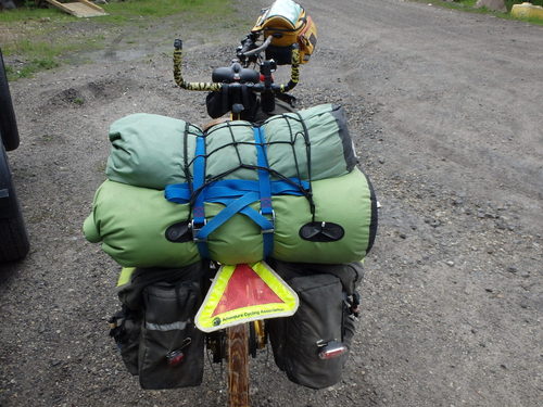 GDMBR: If you carry a cargo net, then mount the net. The trick is to make sure that the net hook tips turn away from the cargo load so as to not punch a hole in the carry bag/sack.