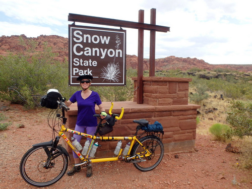 Terry and the Bee at the southern park entrance sign, Snow Canyon State Park, Utah.