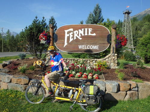 GDMBR: Dennis Struck and the Bee pose next to the official Fernie Welcome sign.