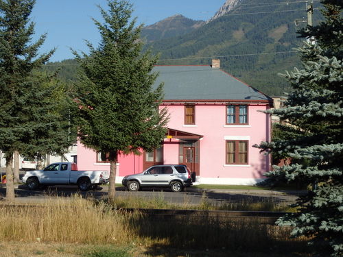 GDMBR: Looking at a pretty pink house across the tracks.