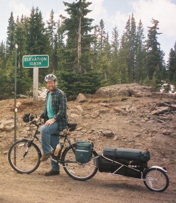 Dennis, next to the summit sign.