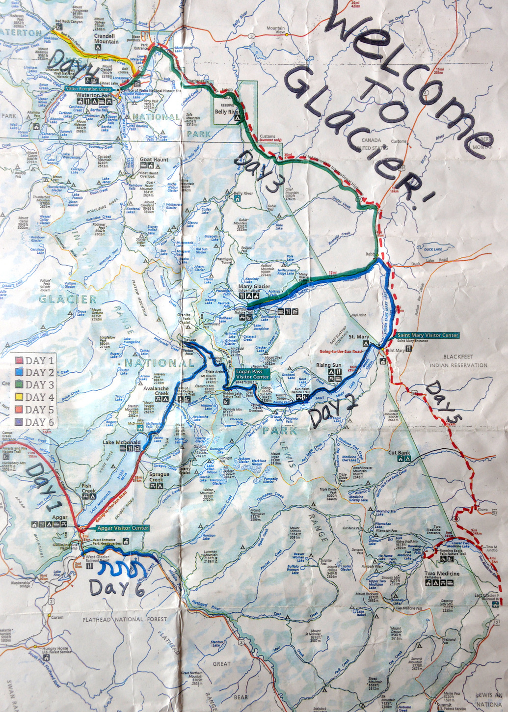 A very used Map of Glacier National Park (Montana, USA) and Waterton Lakes National Park (Alberta, Canada) as issued by Backroads Travel Co.