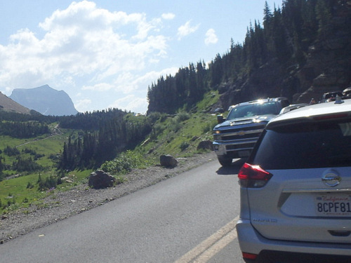 The Traffic Jam is because there are more cars than spaces at the Logan Pass Information Center's Parking Spaces.