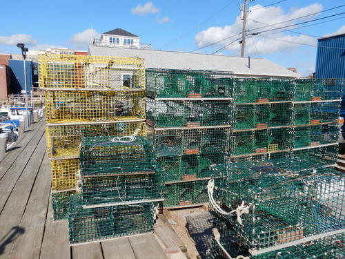 Lobster traps on a wharf.