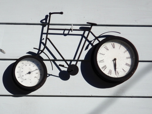 A unique temperature gauge and time piece bicycle display.