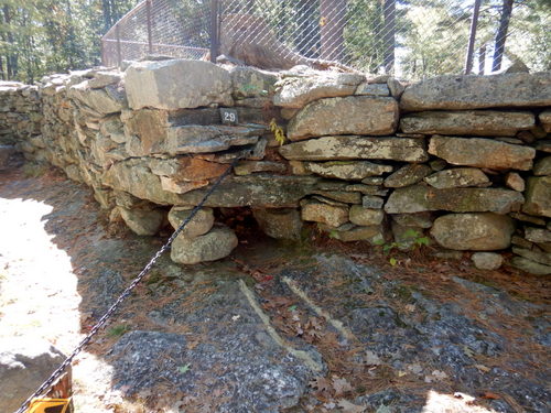 Evidence of stone shaped/chiseled  drainage.