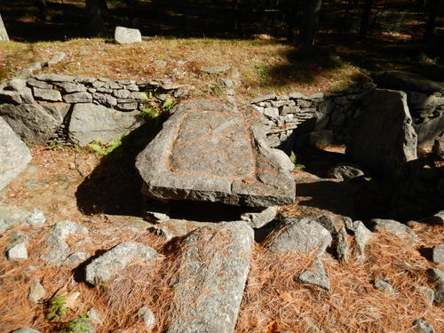 Evidence of stone shaped/chiseled  drainage.