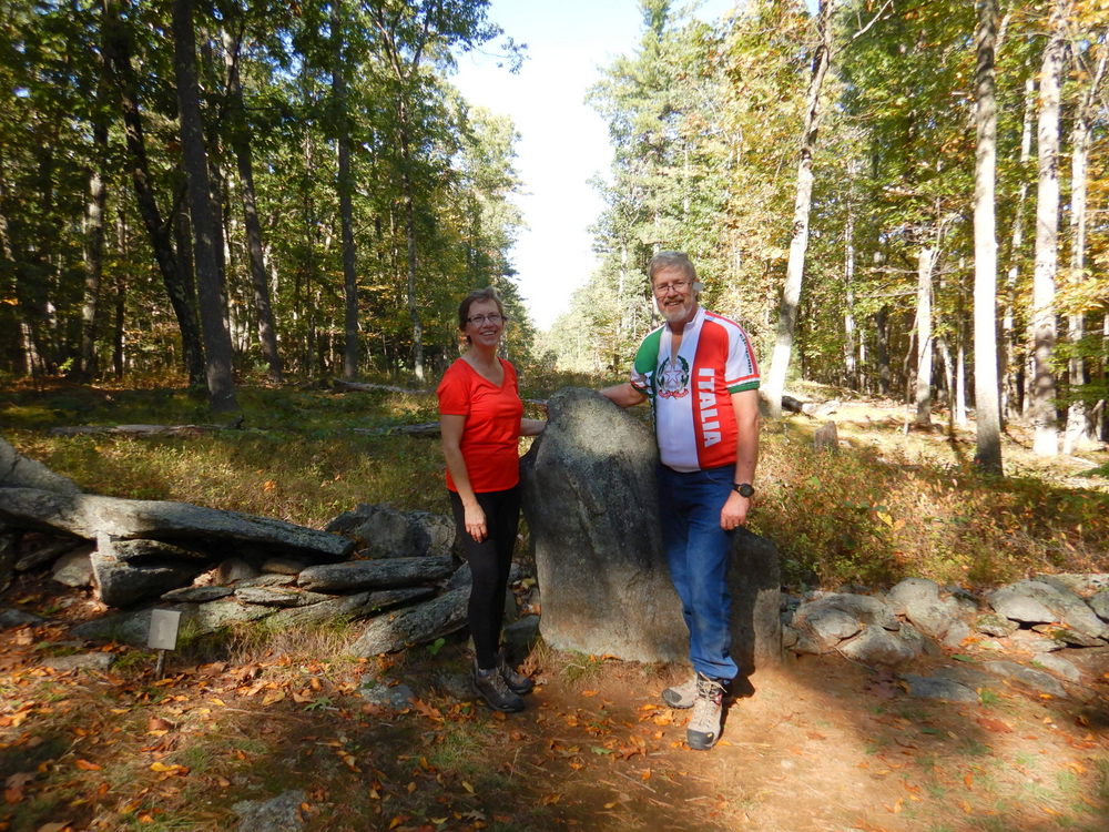 Dennis & Teresa Struck with a Standing Stone Lane Marker at America's Stonehenge.