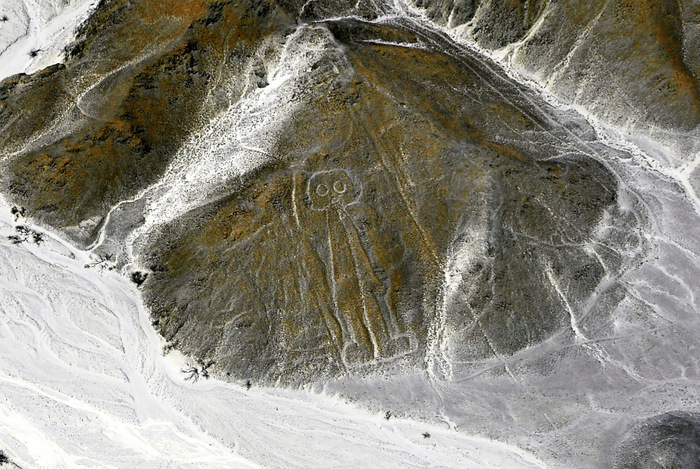 This is my own photo (the object is called The Astronaut), taken above the Nasca Lines, Peru, in September of 2016.