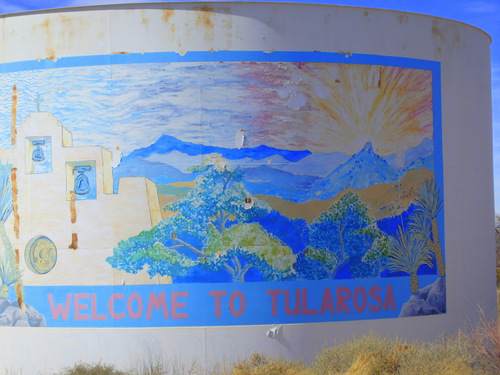 The aging Tularosa Welcome Mural, painted on the side of a tank.