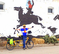 Dennis and the Bee next a building mural in Carrizozo, New Mexico (Photo by Terry)