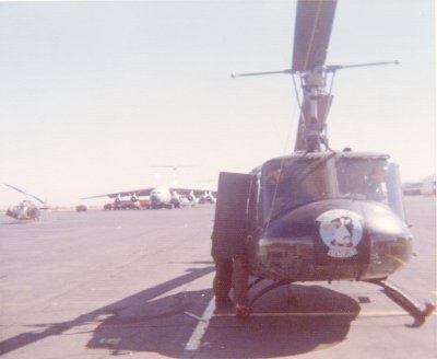 UH-1H, Crew Chief opening Little Side Door.