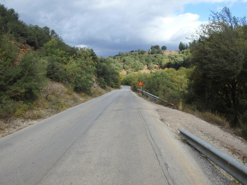 Cycling downhill but slowly because it is rather cool out.